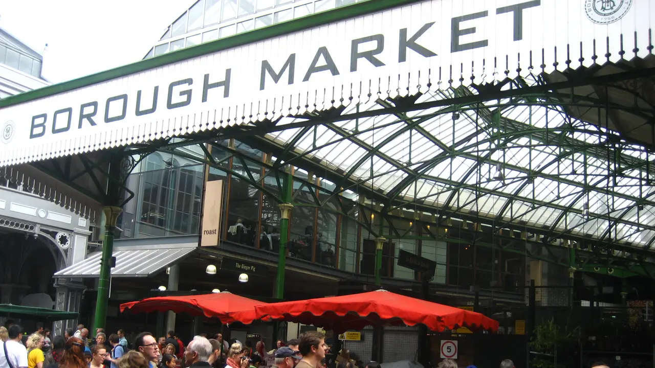 Shoppers under the iron roof of Borough Market in Southwark, south London