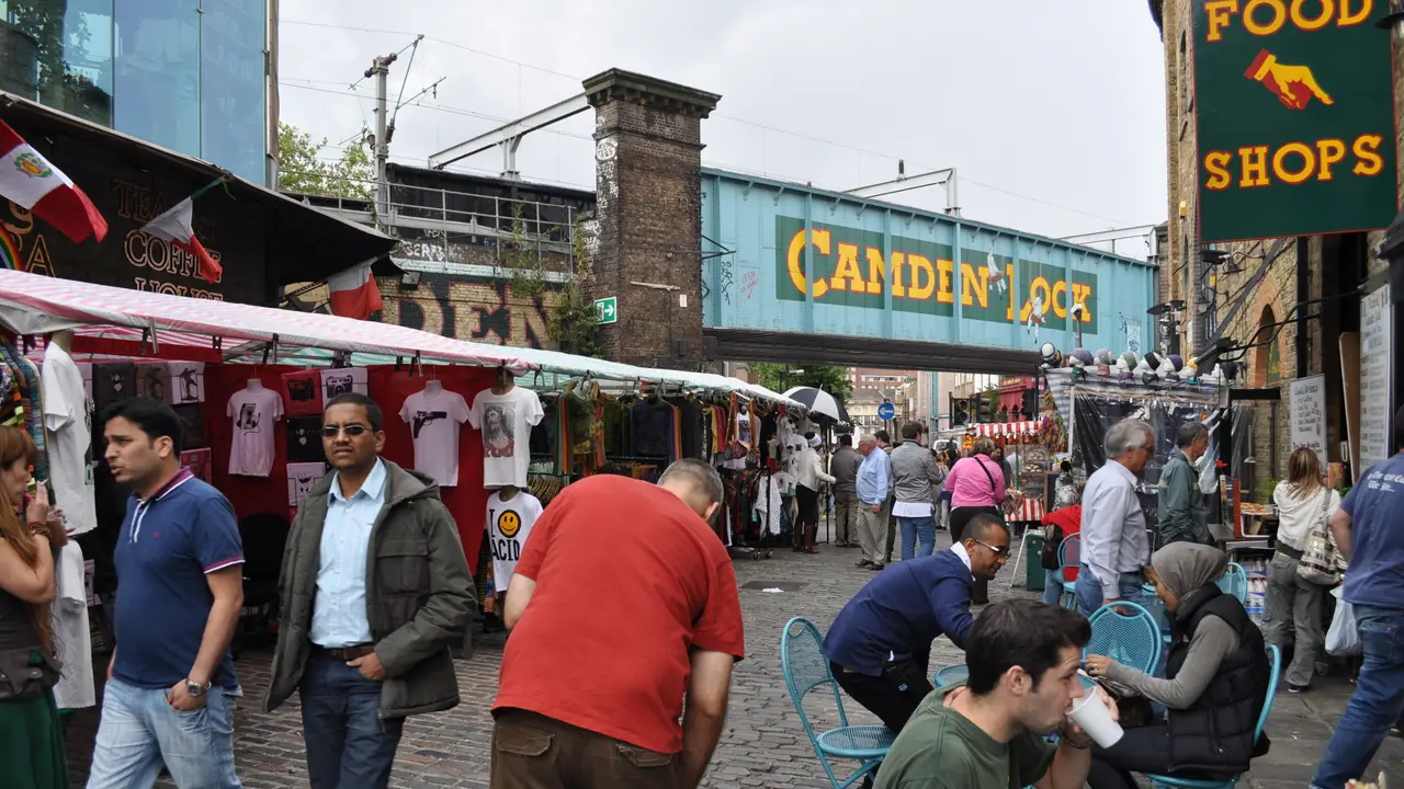 Market stalls and the Camden Lock sign on Camden Lock Place in north London
